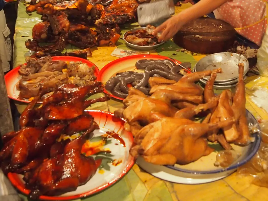 Laos night market food meat chicken sausages