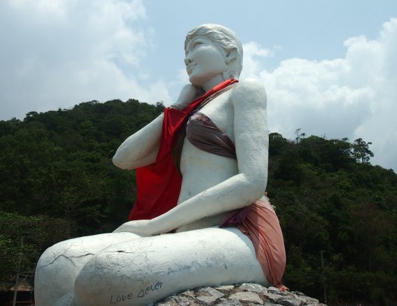 This statue at Kep, Cambodia, the white lady, is regularly dressed by locals to protect her modesty.